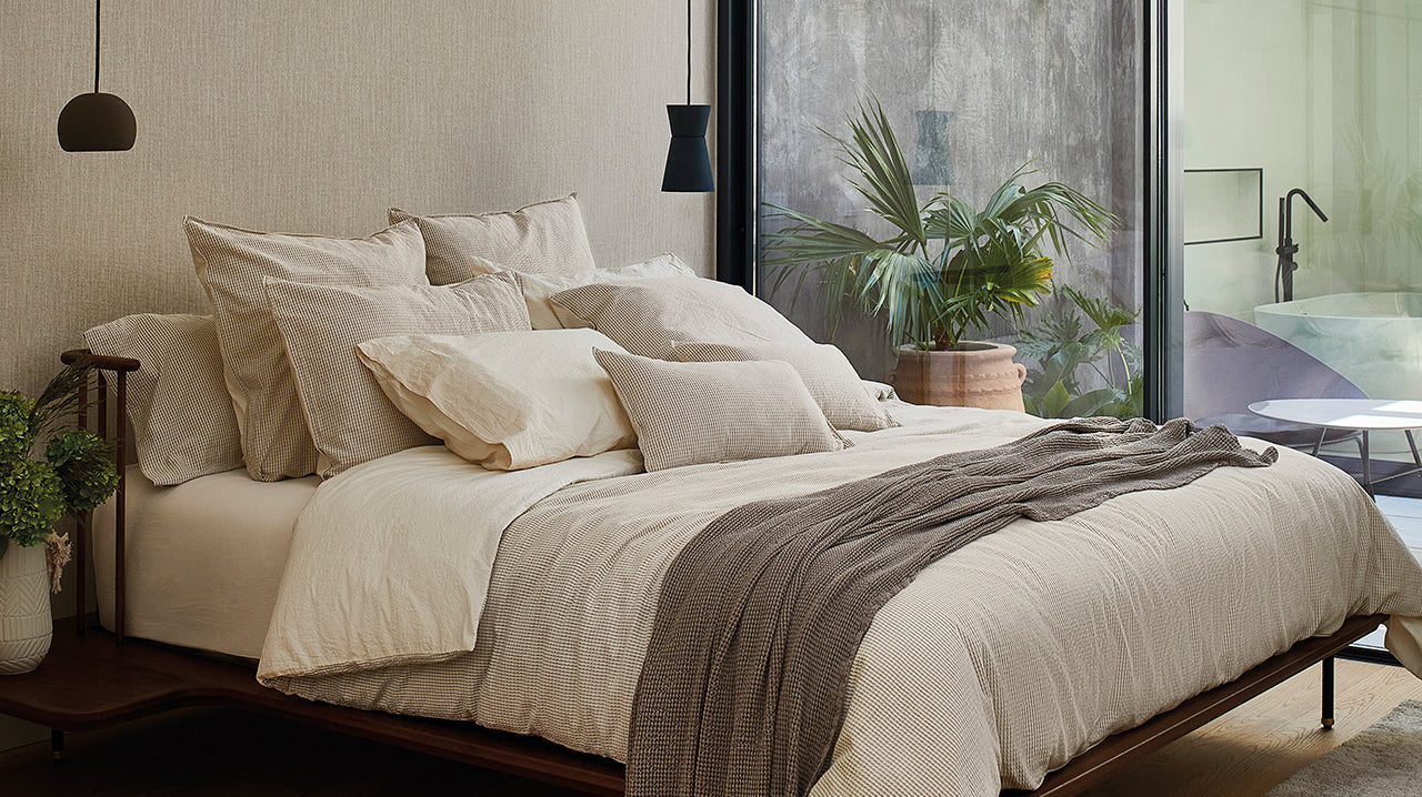 Photo showcasing SOWL's Barcelona Bed Set, made from organic 100% cotton jacquard in washed beige. Includes duvet cover and pillow cases