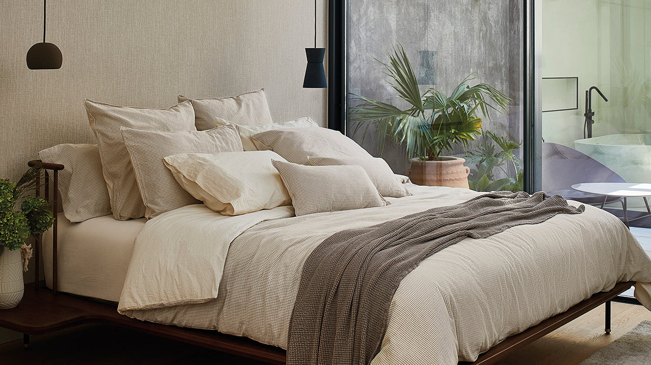 Photo showcasing SOWL's Barcelona Bed Set, made from organic 100% cotton jacquard in washed beige. Includes duvet cover and pillow cases 