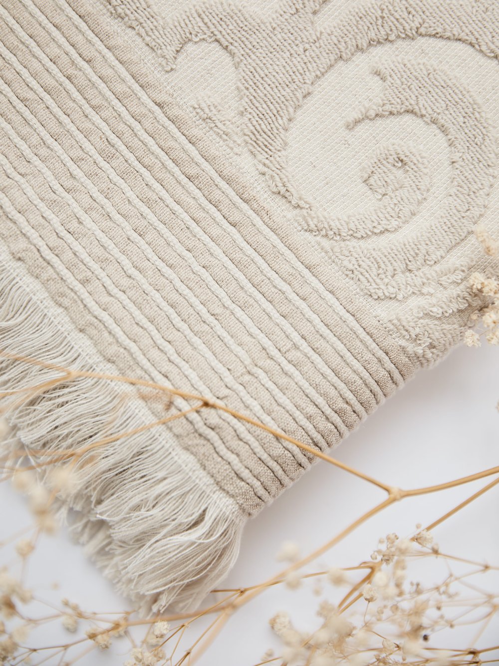 Harmony premium cotton bath towel in elegant beige, offering luxurious comfort and style.