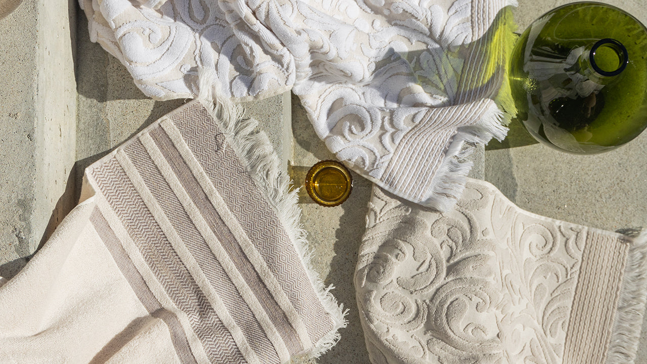 Photo of SOWL bath towel in Morning Dunes and Harmony Sunlit Sand colors, made from premium 100% cotton.