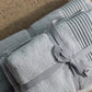 Silver Mist Fluffy Bath Towel - A luxurious and plush bath towel in a serene silver mist color. Designed for ultimate comfort and absorbency, perfect for indulging in post-shower relaxation. Crafted from premium materials to provide a soft and gentle feel against the skin.