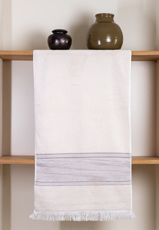 Sunlit Sand premium cotton bath towel, exuding warmth and comfort for a blissful bathing experience