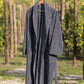 Sequoia organic cotton men's bathrobe in beige, displayed on a hanger, showcasing its plush texture and comfortable fit, perfect for lounging after a shower or bath.