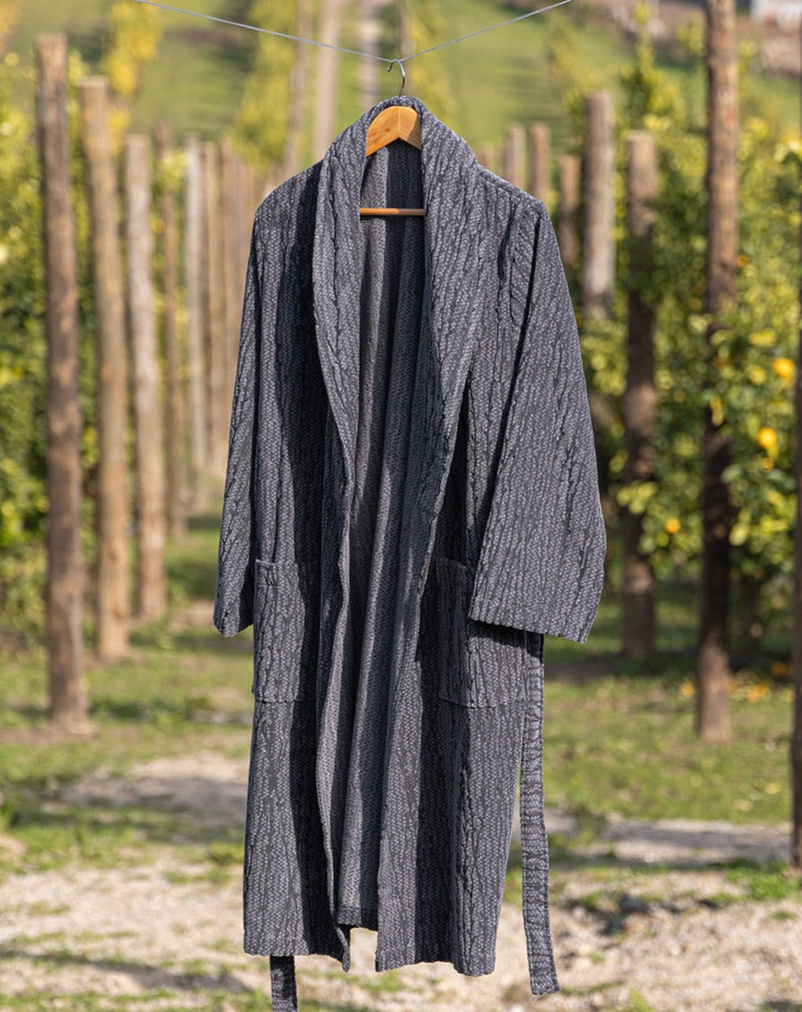 Sequoia organic cotton men's bathrobe in beige, displayed on a hanger, showcasing its plush texture and comfortable fit, perfect for lounging after a shower or bath.