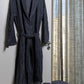 Sequoia organic cotton men's bathrobe in beige, displayed on a hanger, showcasing its plush texture and comfortable fit, perfect for lounging after a shower or bath.