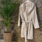 Beige Swell organic cotton bathrobe, featuring a luxurious and soft texture, perfect for ultimate comfort and relaxation.